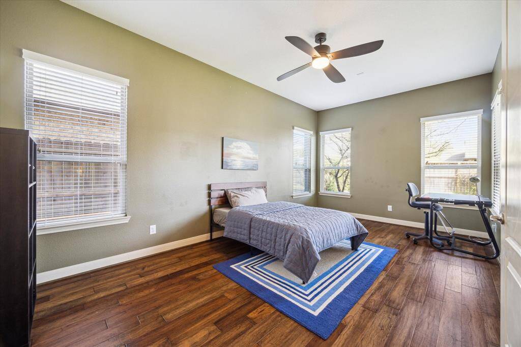 First floor flex room or guest bedroom with engineered hardwoods and ensuite bath.