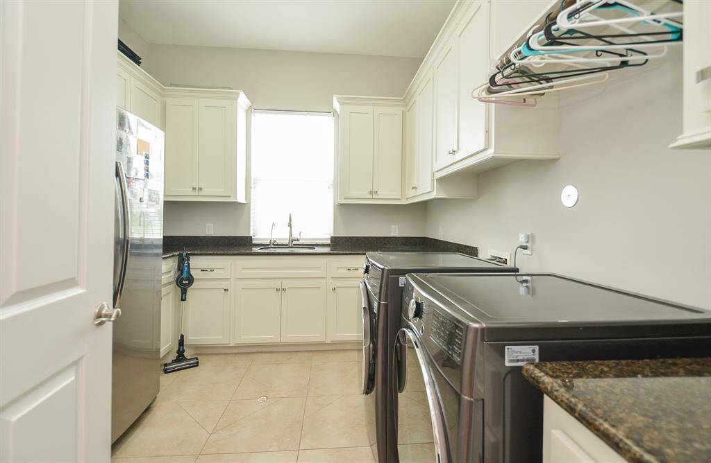 Oversized laundry room with sink