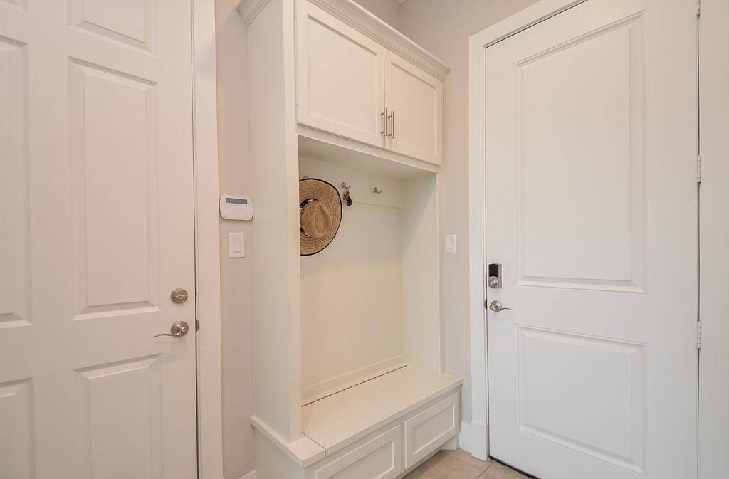 Mudroom off the garage and back door of the driveway