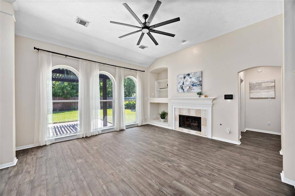 View of the family room with the fireplace and built in cabinets being a great focal point to the home!