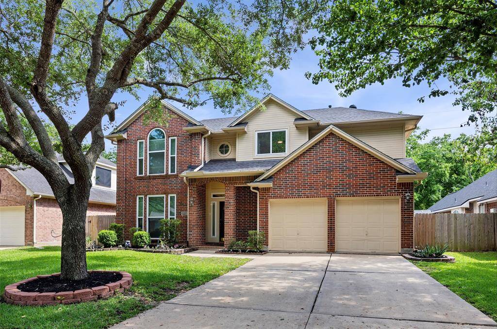 Mature Trees and fresh landscaping really add to the beautiful curb appeal!