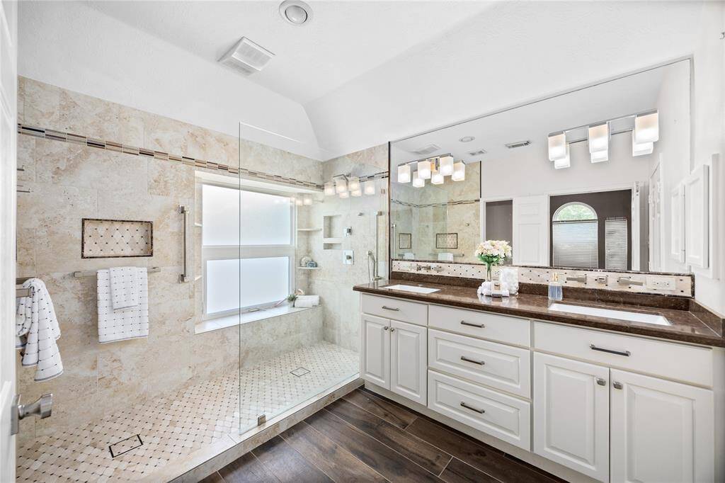 WOW! This Primary Bathroom is your own personal SPA! Massive walk in Shower, granite counter tops, updated sinks, updated faucets, updated lighting, and updated flooring just create the peaceful vibe that the new owners will get to enjoy!