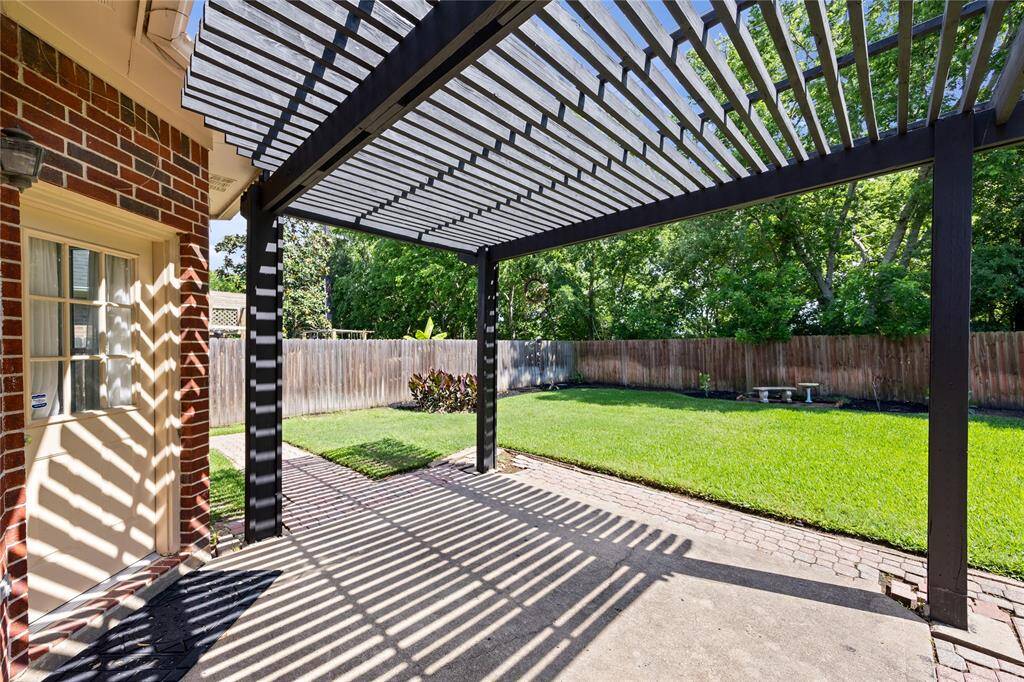 Step outside and enjoy the outdoors! This covered pergola helps to keep your time outside cool and shaded!
