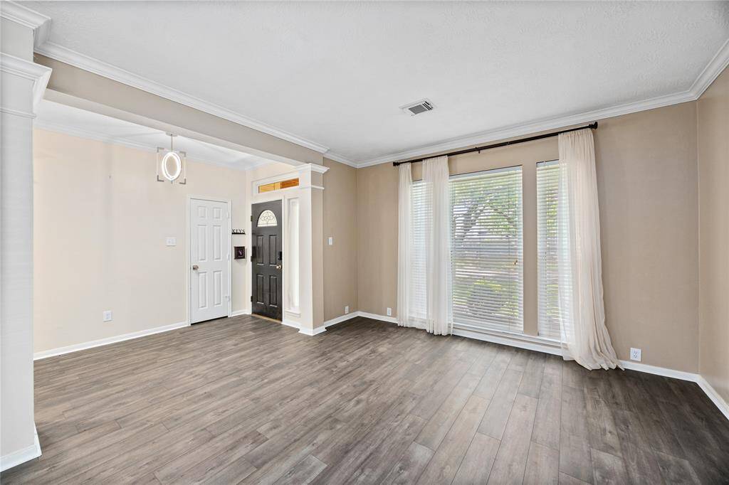 Formal Living Area can easily be converted to an office area, sitting lounge, extra play area, or even a home Gym...lots of different ways this space can be utilized!