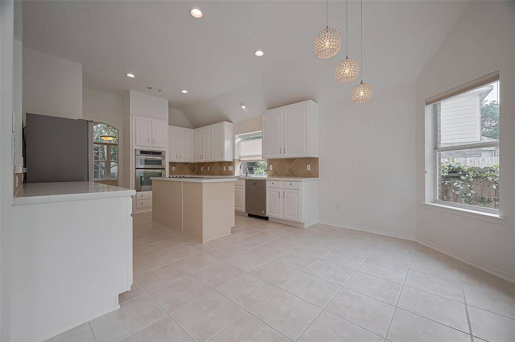 Space keeps flowing into the breakfast room and kitchen.
