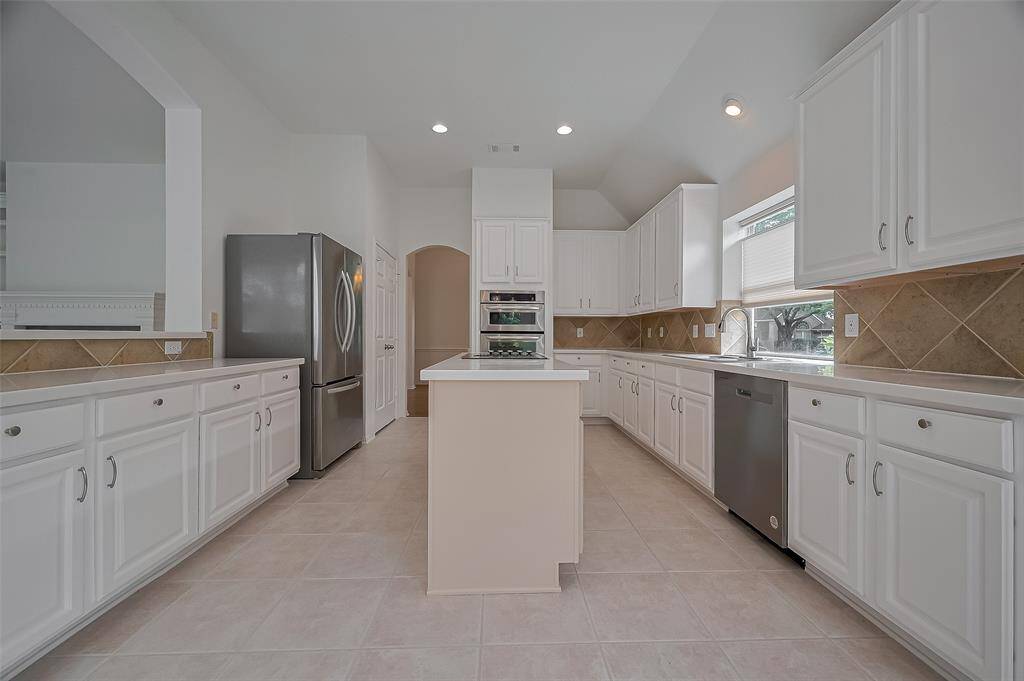 Functional kitchen boasts of 10 ft high ceilings.