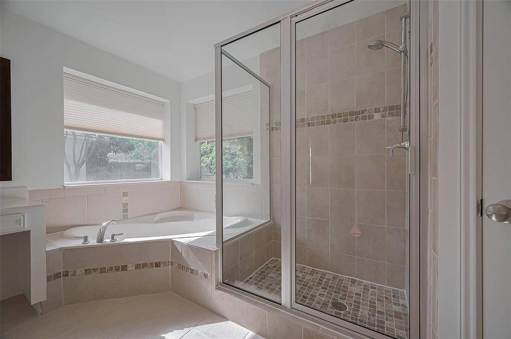 Separate soaking tub & standing shower for your convenience.