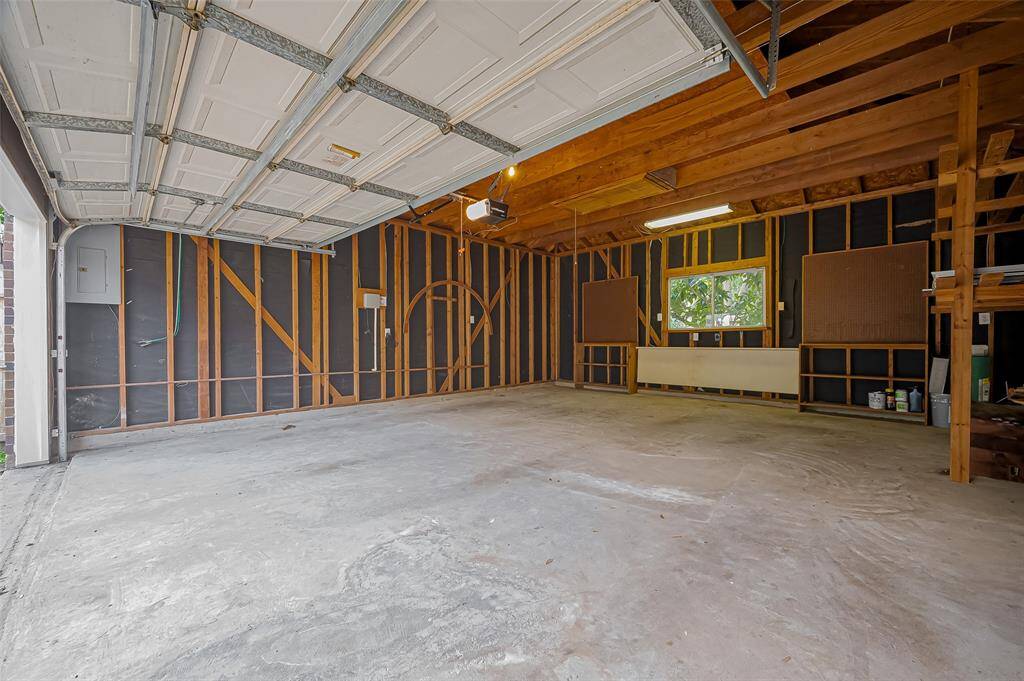 Extra large double garage with a convenient foldable table and a storage loft.