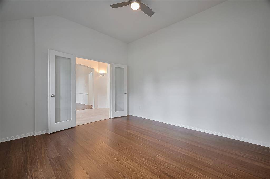 Private dedicated home office with french doors.