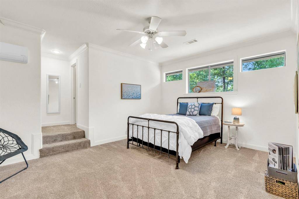 Upstairs, you will find a spacious secondary bedroom filled with natural light and attic access.