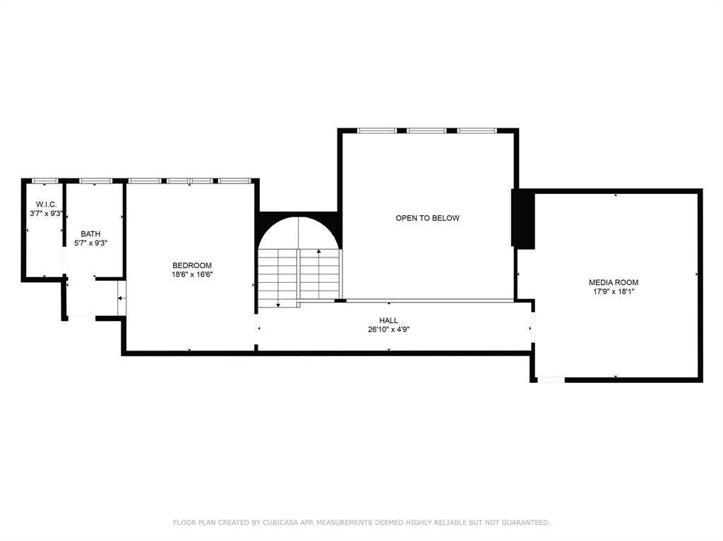 Upstairs, discover a spacious bedroom with its own private bath and large walk-in closet, connected via an elegant hallway open to the living area below. The expansive media room offers the perfect space for entertainment and relaxation, ideal for family movie nights or hosting friends.