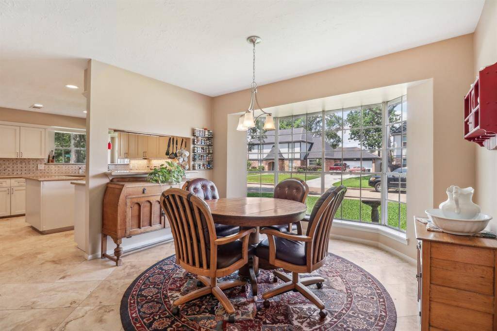 Separate breakfast room is very spacious and has a pretty bay window overlooking the side yard.