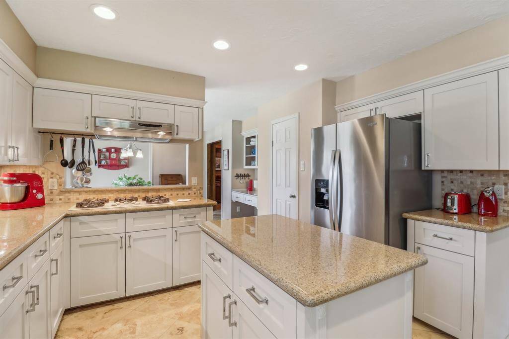 The storage in this kitchen is incredible. Cabinets feature under-cabinet lights to add a soft glow in the early mornings and late evenings.