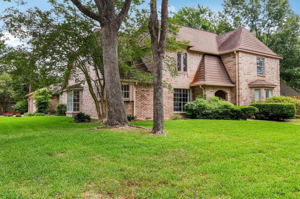 Notice the mature landscaping, the traditional elevation and the charming leaded glass window pane accents in some of the windows.