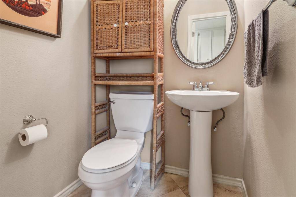 Downstairs half bath is located in the laundry room.