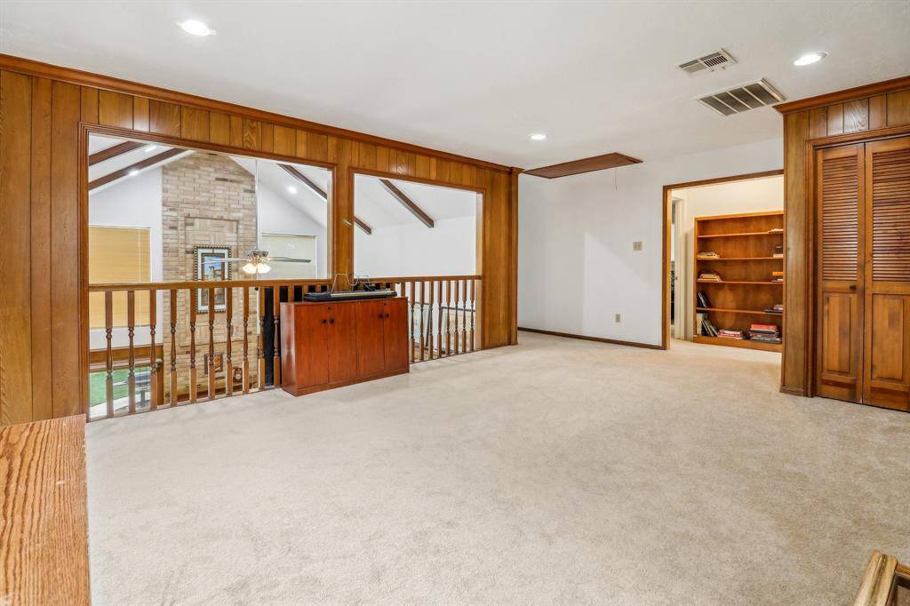 From the game room is a short hall with two bedrooms and a Jack-and-Jill styled bath. On the other side of the game room is a third bedroom with a full private bath.