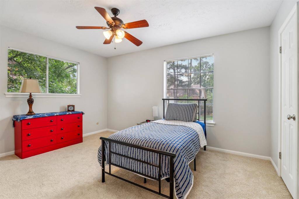 Secondary bedroom with 2 large windows and room for everything.