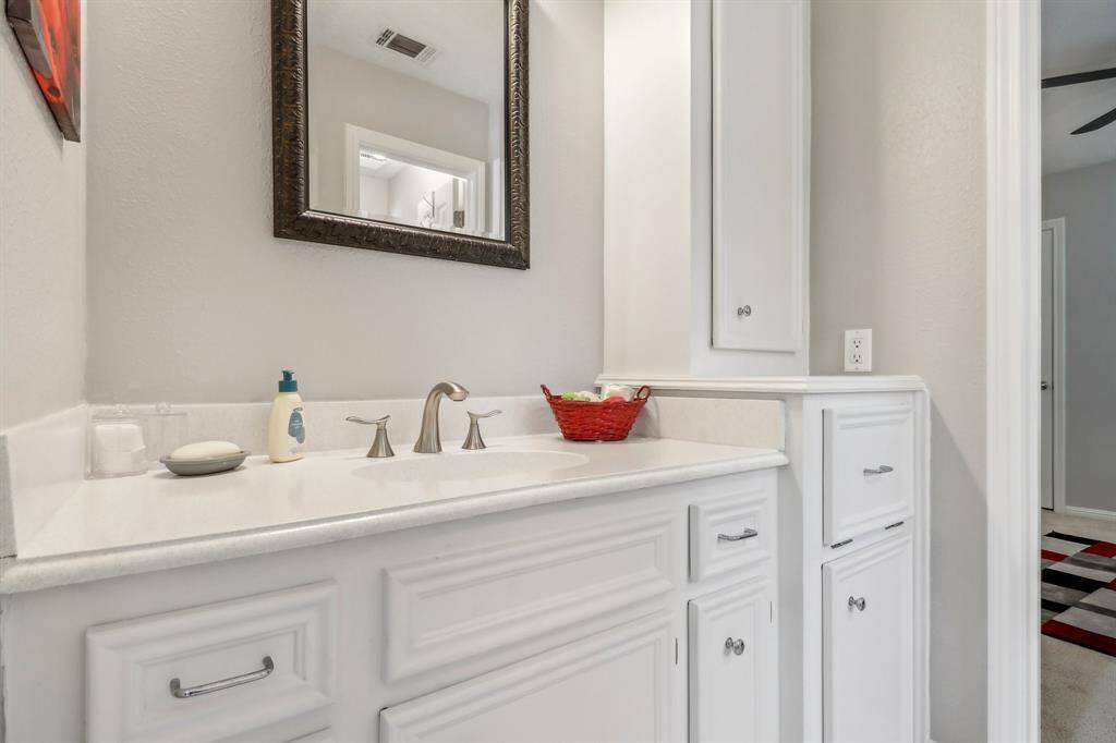 Shared bath with sink/vanity area.