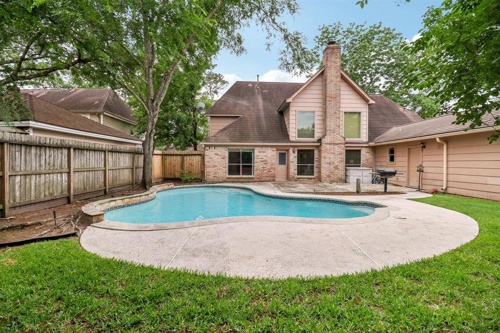 Decking bump out allows for seating and umbrellas. Great patio with built-in BBQ pit.