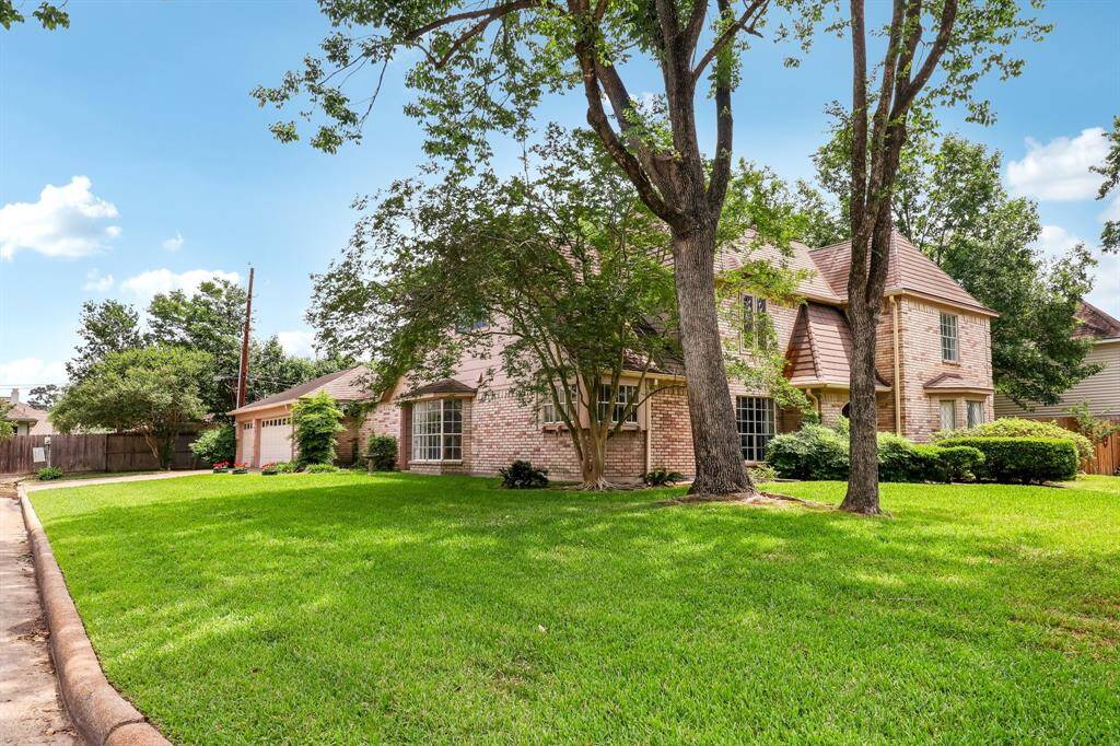 Highly sought after side entrance 3-car garage. The street does not go through along the side of the home. Beautiful crepe myrtle tree at corner of kitchen window.