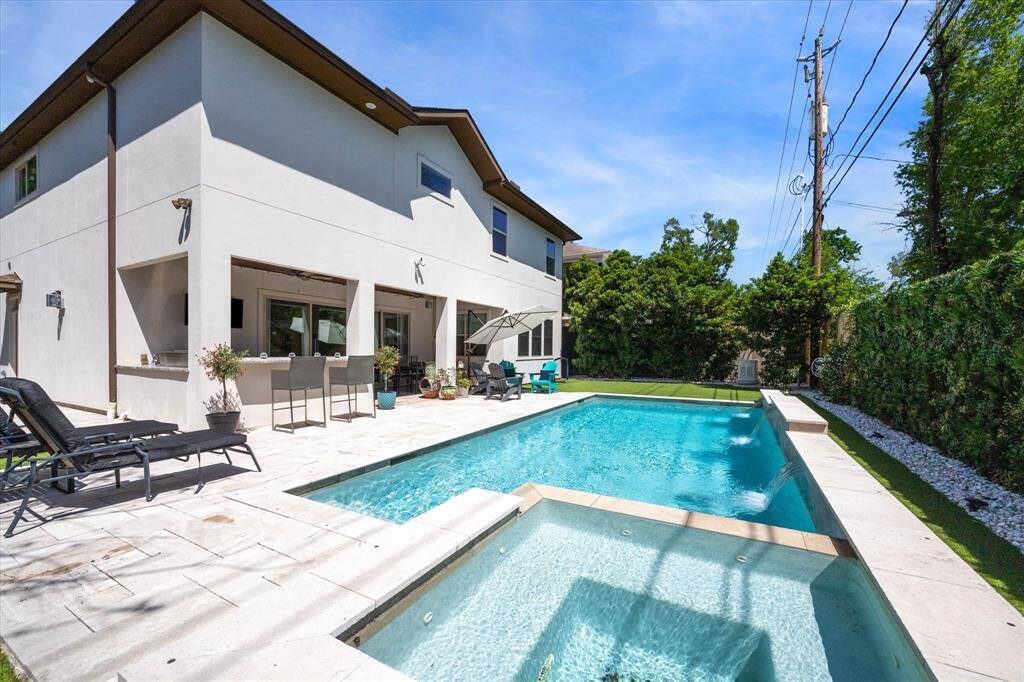 Enjoy a seamless blend of leisure and entertaining in this resort-style backyard, complete with a sparkling pool, spa, and spacious travertine deck. Lush greenery offers added privacy, while the recently installed home generator provides peace of mind year-round. Whether hosting outdoors or unwinding at home, this space delivers comfort on every level.