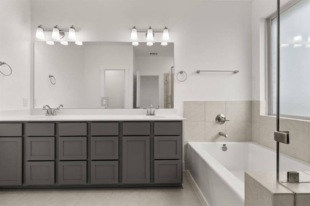 Enjoy the privacy of a well-appointed primary bath in your suite