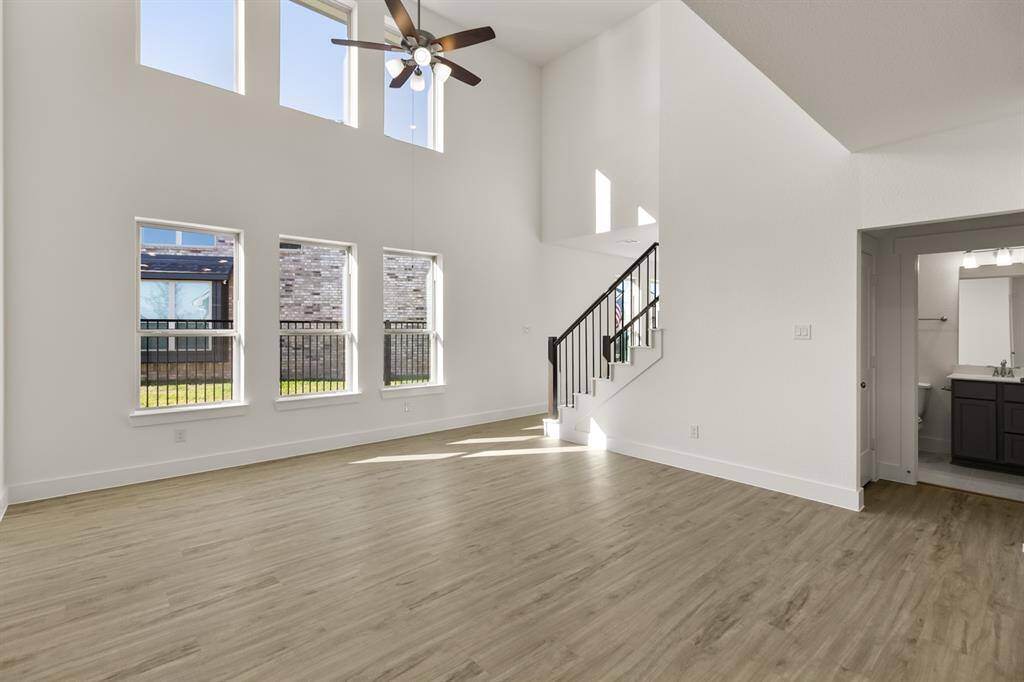 Picture expansive windows that invite natural light to dance through spacious living areas, creating a welcoming atmosphere perfect for gatherings or quiet moments of reflection.