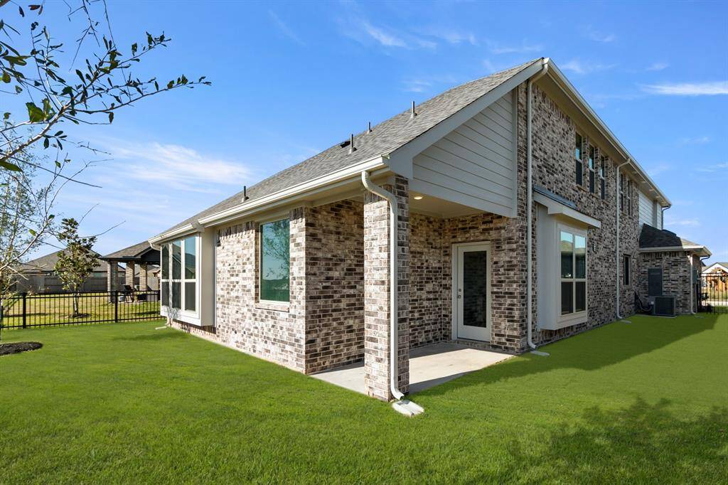 Imagine stepping into your own personal oasis—a spacious covered back patio that invites you to savor every moment outdoors, regardless of the weather.