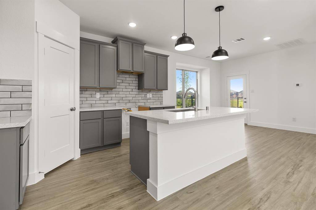 The open layout invites laughter and warmth, making it the perfect backdrop for family gatherings or cozy brunches with friends.