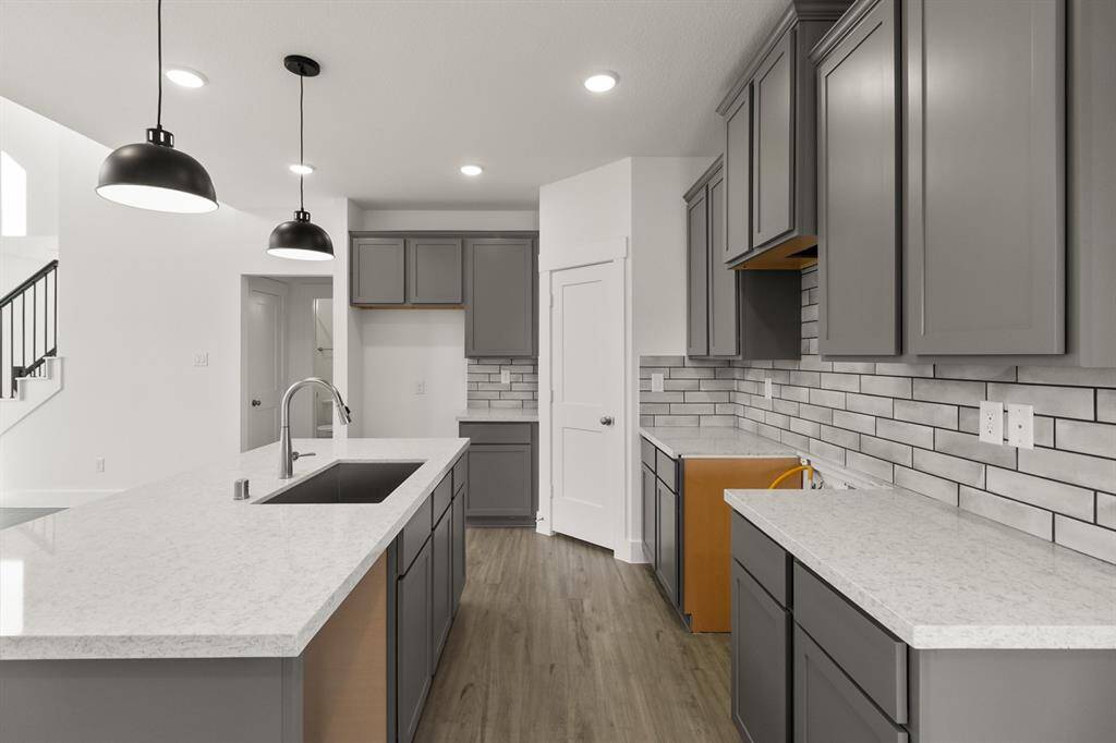 Step into a kitchen that feels like a warm embrace, where modern elegance meets the heart of home.