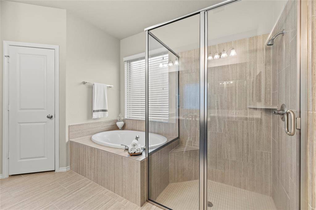 Oversized shower and soaking tub.
