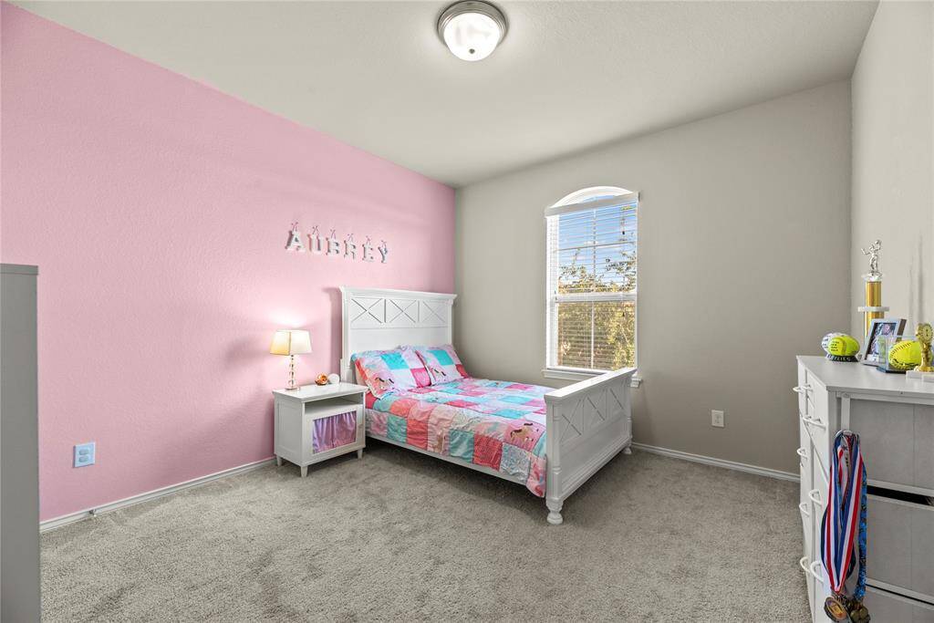 Upstairs secondary bedrooms are spacious and feature plush carpet and large closets.