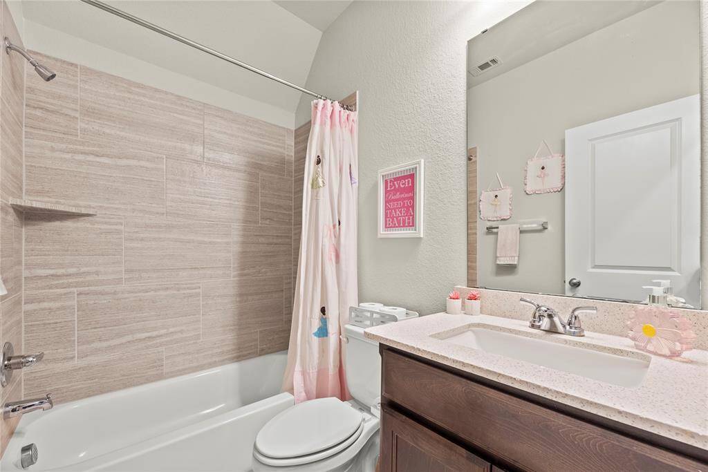 One of two full upstairs bathrooms.
