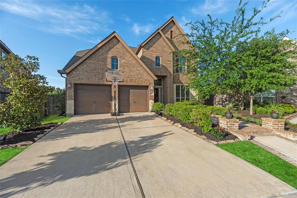 Attached 2-car garage with a double-wide driveway provide ample parking.