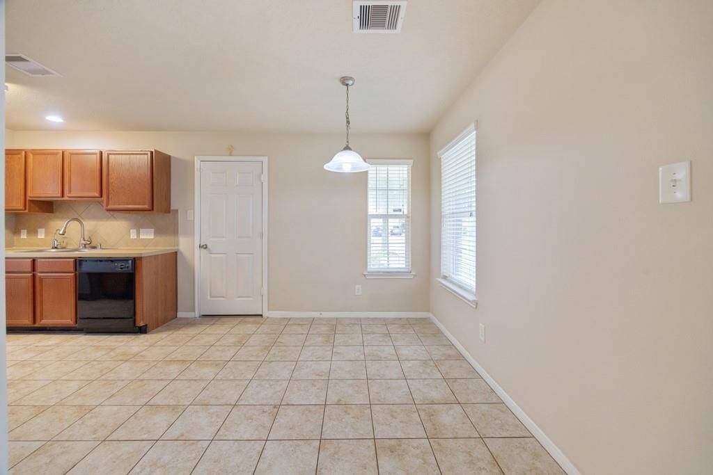Large dinning/breakfast room with natural light next to kitchen