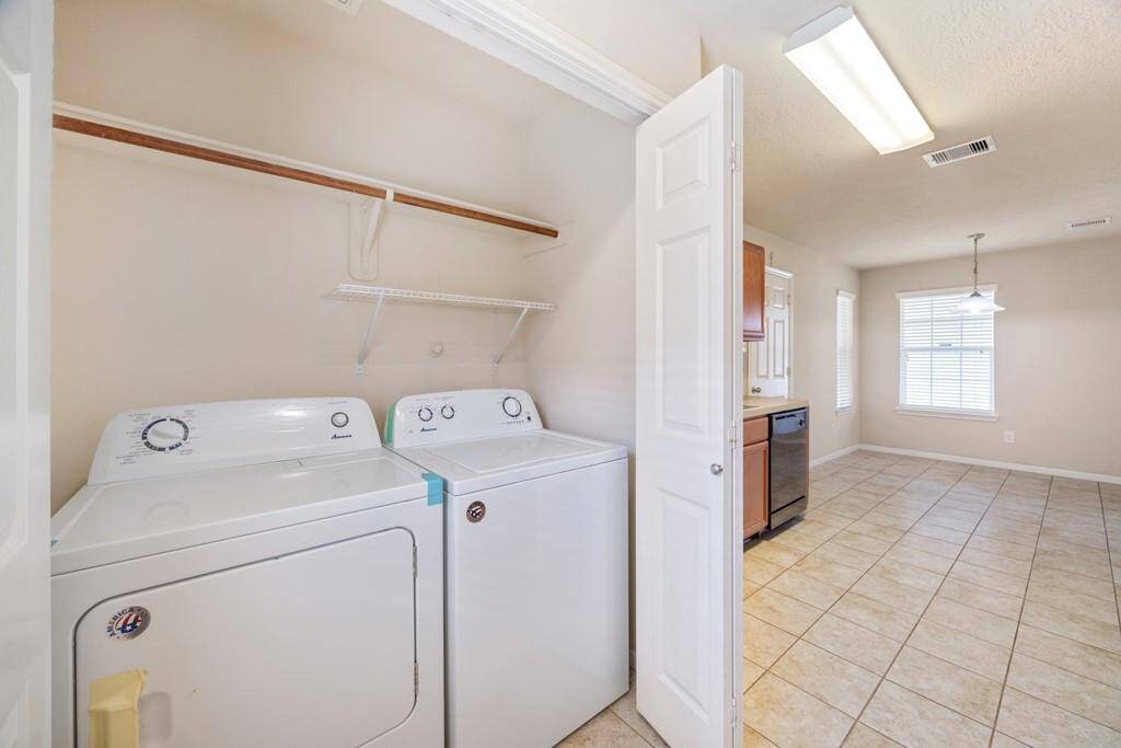 Laundry room conveniently located in the kitchen with washer and dryer included