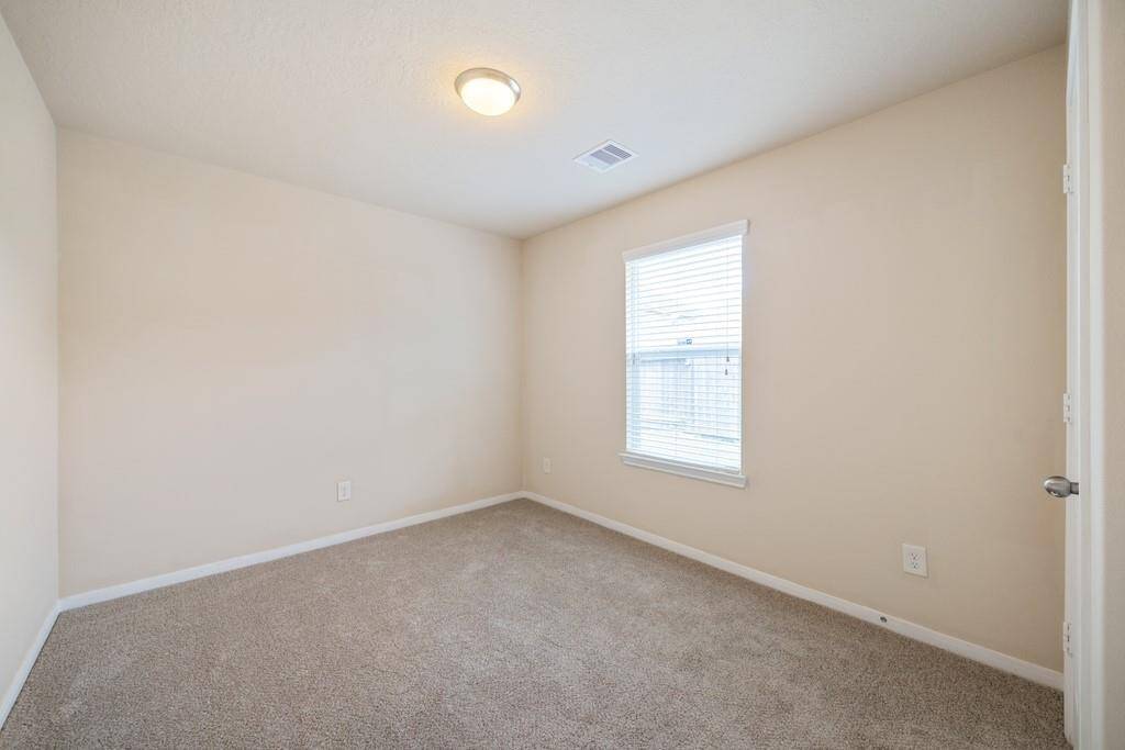 2nd bedroom with new carpeting