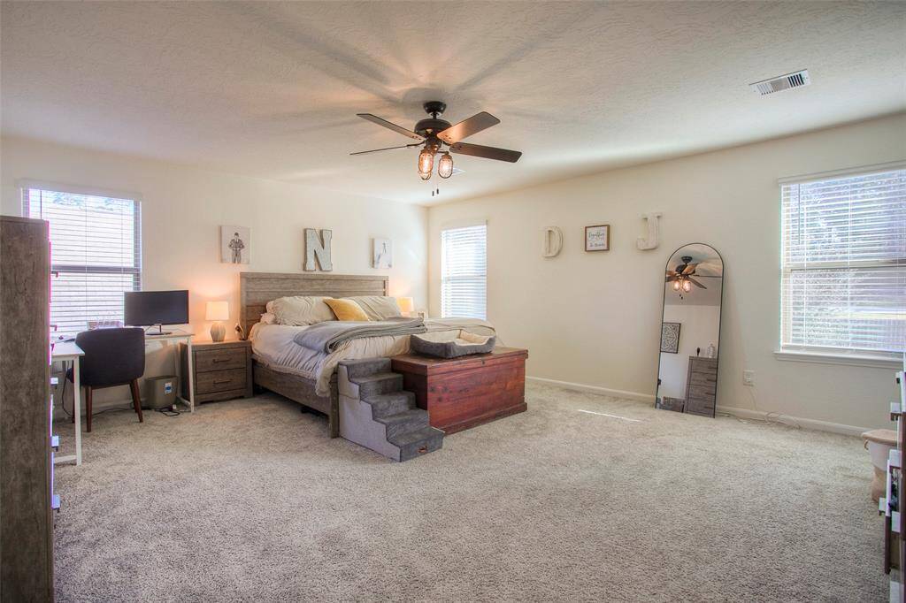 ...while the private primary suite features a large walk-in closet and spa-inspired bath with separate shower, Kohler Windward soaking tub, and dual sinks.