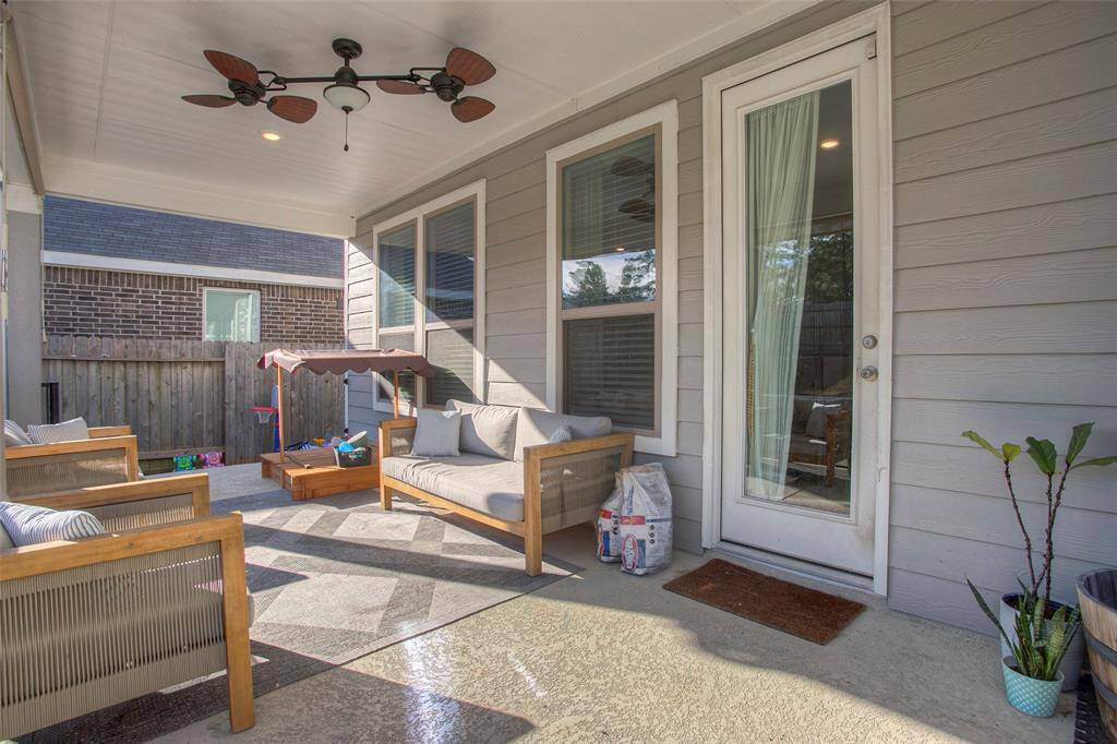 Step outside and you'll see what truly sets this home apart—a covered patio, extended concrete entertaining space...