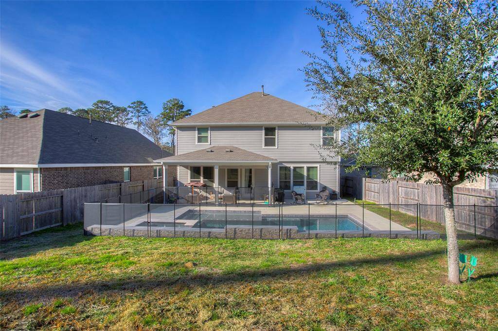The fully fenced backyard offers the perfect balance of relaxation and fun, whether you're hosting guests or enjoying a quiet evening.