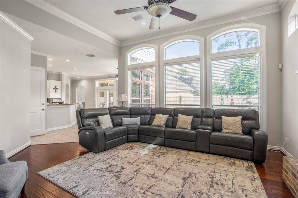 Expansive living room with a wall of windows providing abundant natural light