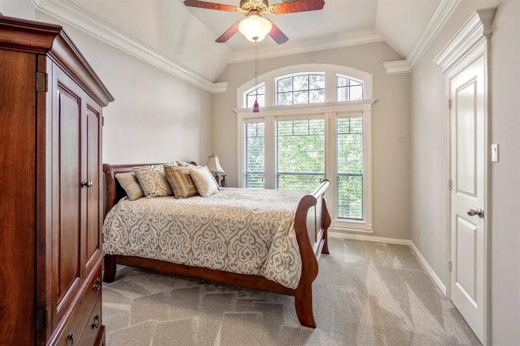 Cozy guest suite complete with ensuite bathroom and spacious walk-in closet.