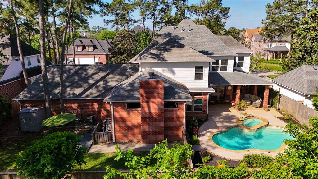 Enjoy both the pool and backyard green space on this expansive lot