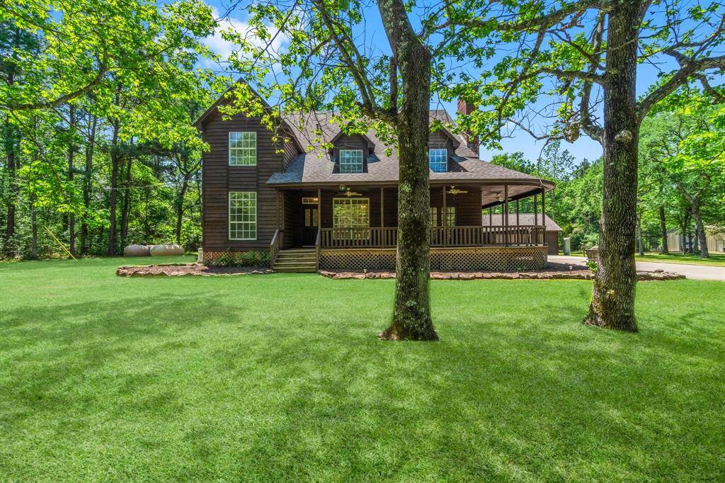 Spacious home on 9.67 acres of beautiful pines and hardwoods.