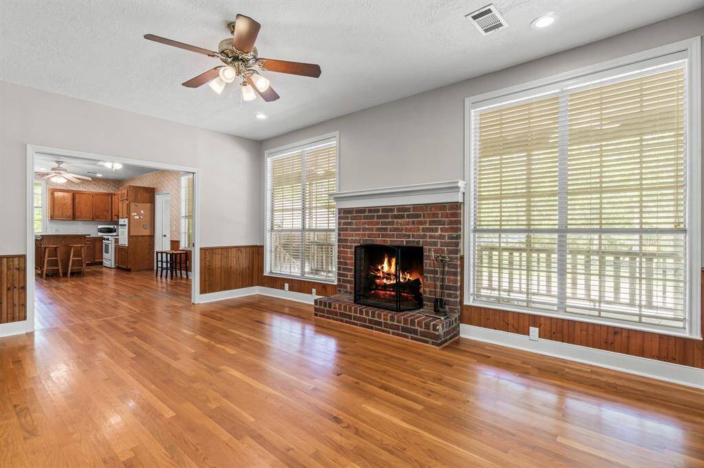 Beautiful brick fireplace and windows.