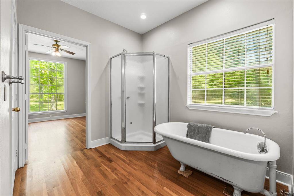 Primary bath with shower and relaxing soaking tub.