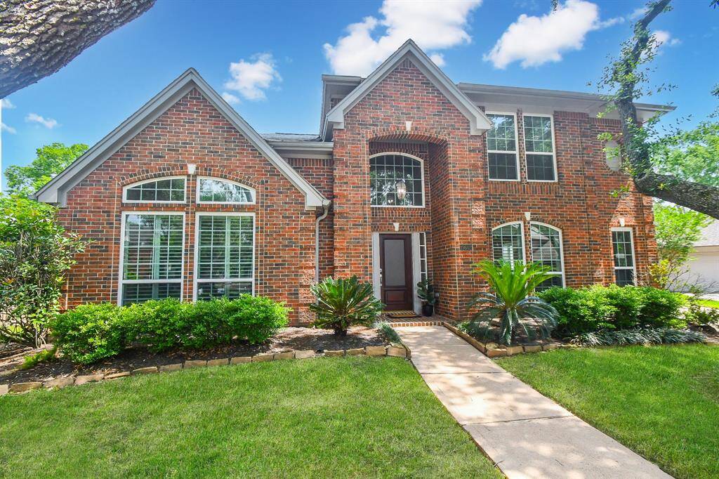 Come home where you’re cheerfully greeted everyday with your vibrant front lawn. Note your home's regal exterior and your covered entryway for all your Amazon packages and for your friends and family to dive under on rainy days.