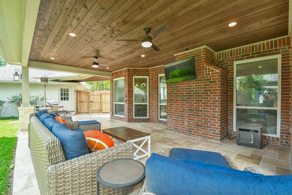 Heading outside, your covered extended patio installed in 2019 with stone laid floors is the perfect area to relax with a book in hand or as you watch and cheer for the Rockets and Texans while taking in the warmth of brighter spring days.