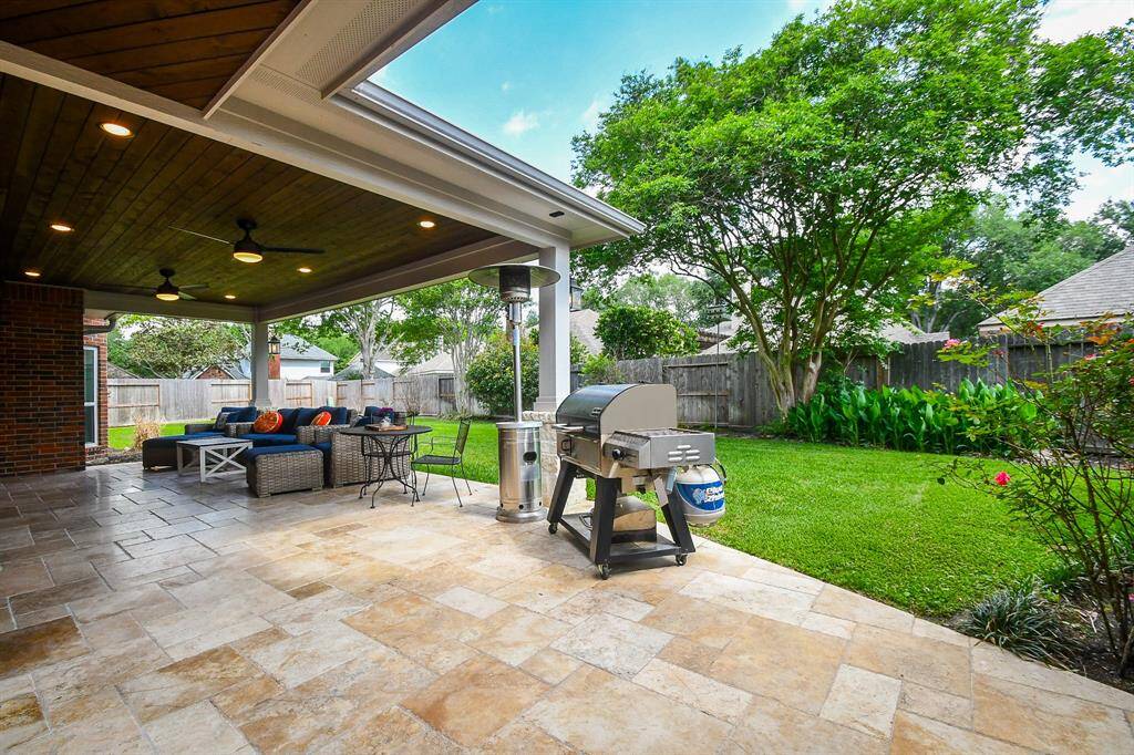 Put on your chef's apron and grab your trusty tongs as you cook ribs on your BBQ grill for friends and family with the complete privacy of a fully fenced back yard, recently replaced back fence in 2022 and side fence in 2023 all laced with well-manicured luscious landscaping.