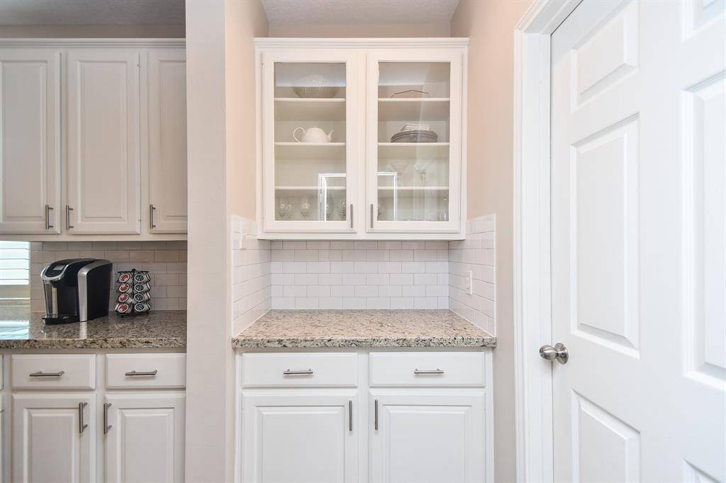 Your butler’s pantry offers additional storage for your fine China and wine, as well as extra counterspace to elevate your hosting experience. To your right is your utility room to tuck away all the laundry and housekeeping supplies.